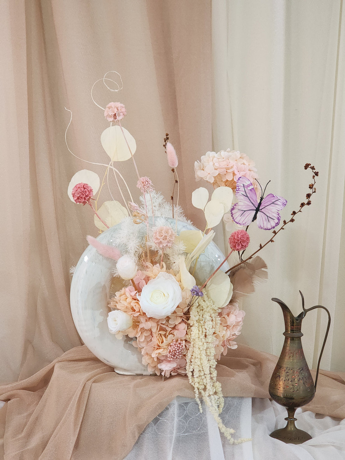 Handcrafted donut vase with blush preserved flower arrangement, full view